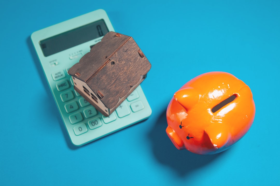 Calculator and coins representing EV tax credits and savings