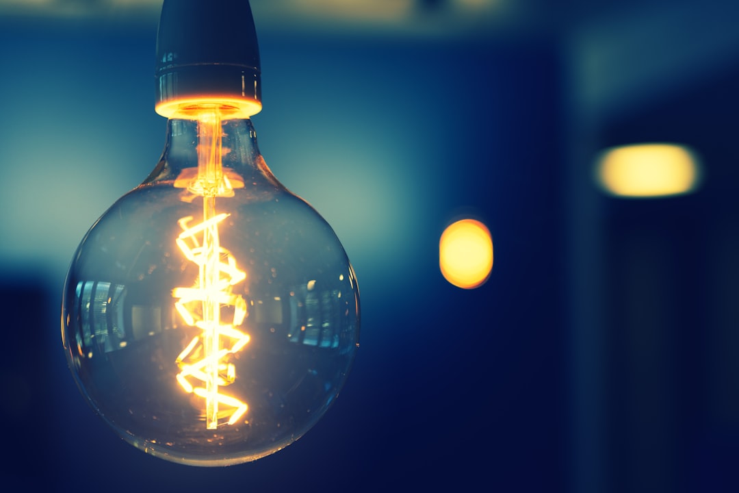 Glowing light bulb representing lower electricity bills