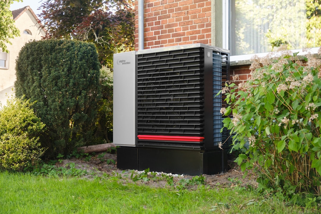 A modern heat pump unit outside a house